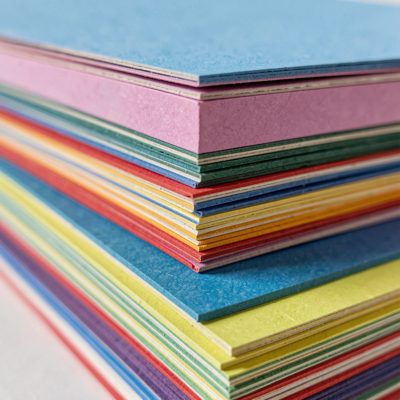 a stack of coloured paper edges close up