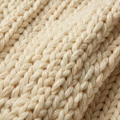 a knitted wool texture in cream