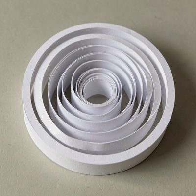 a spiral of white paper strips