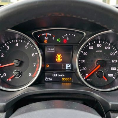 a dashboard warning light illuminated on a car binnacle