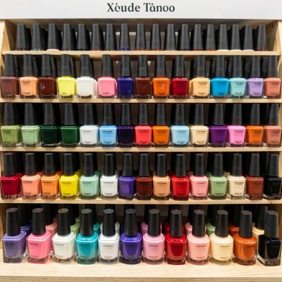 a display of nail varnish bottles by colour