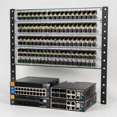 a rack mounted patch panel sitting above two switches