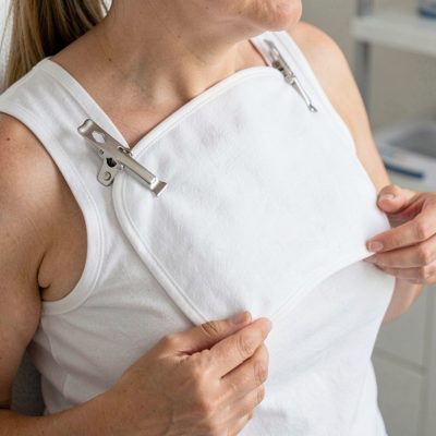a patient bib being clipped on