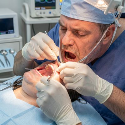 oral surgeon preparing incision site carefully