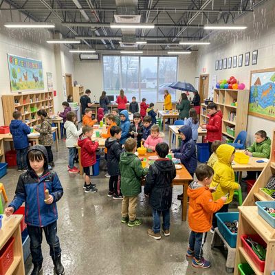 rainy day indoor recess activity center bustling with kids