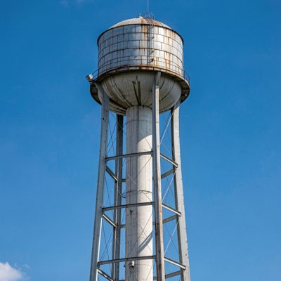 a water tower against a blue sky