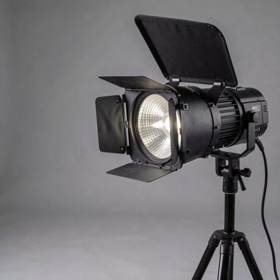 a studio light being flagged with a black panel