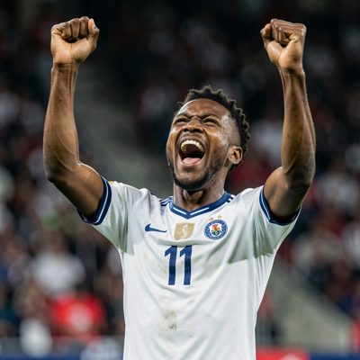 a player celebrating with arms raised