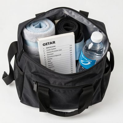 gym bag containing towels, water bottle, and gear list