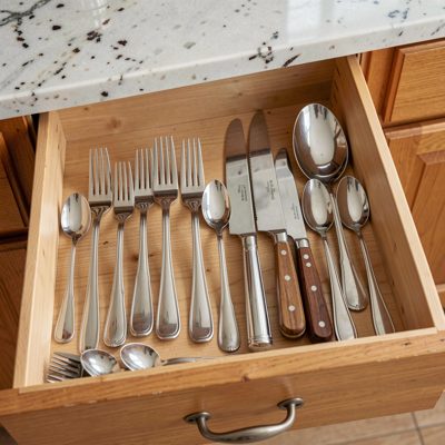 a kitchen drawer of cutlery neatly arranged