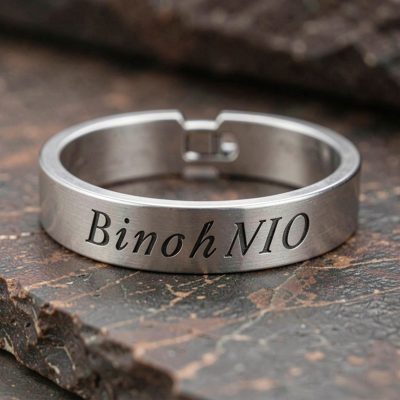 a bracelet being engraved with initials