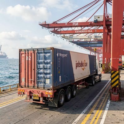 a container being loaded at a port
