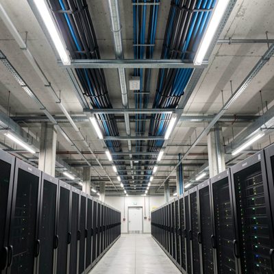 a cable raceway running along a data centre ceiling