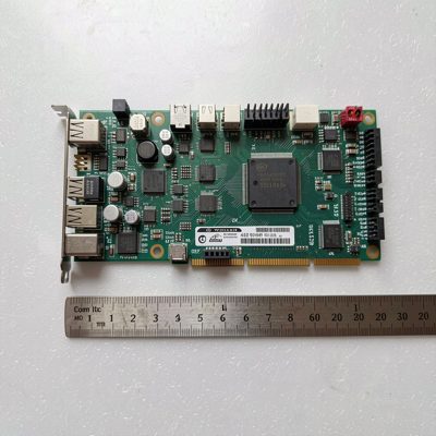 a mini itx motherboard beside a ruler for scale