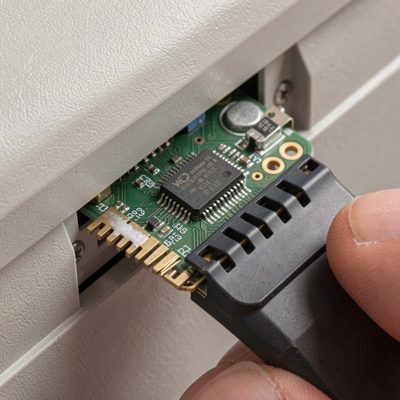 a ram module being pressed into a slot until the clips close