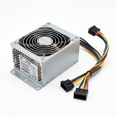 a modular power supply with its cables detached beside it
