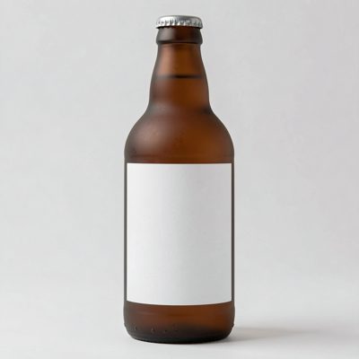 a frosted glass bottle with a blank white label on a light background