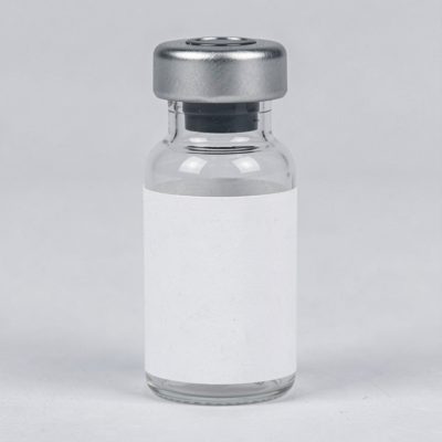 a small sample vial with a blank white label