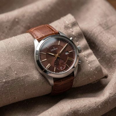 a wristwatch photographed on a folded cloth