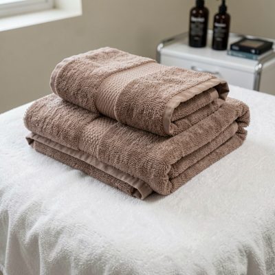 a hot towel being folded ready for a treatment