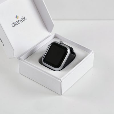 a wearable being unboxed on a clean surface
