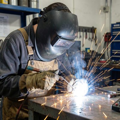 a welder working with sparks flying