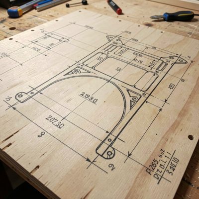 a template being traced onto plywood